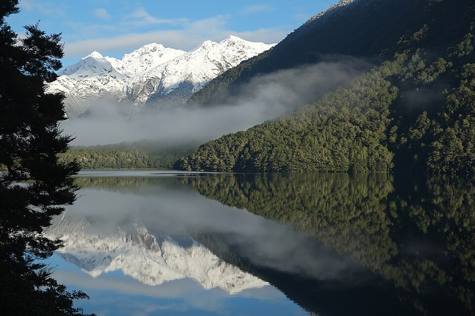 Mountains reflecting in calm lake - how EMDR works for trauma