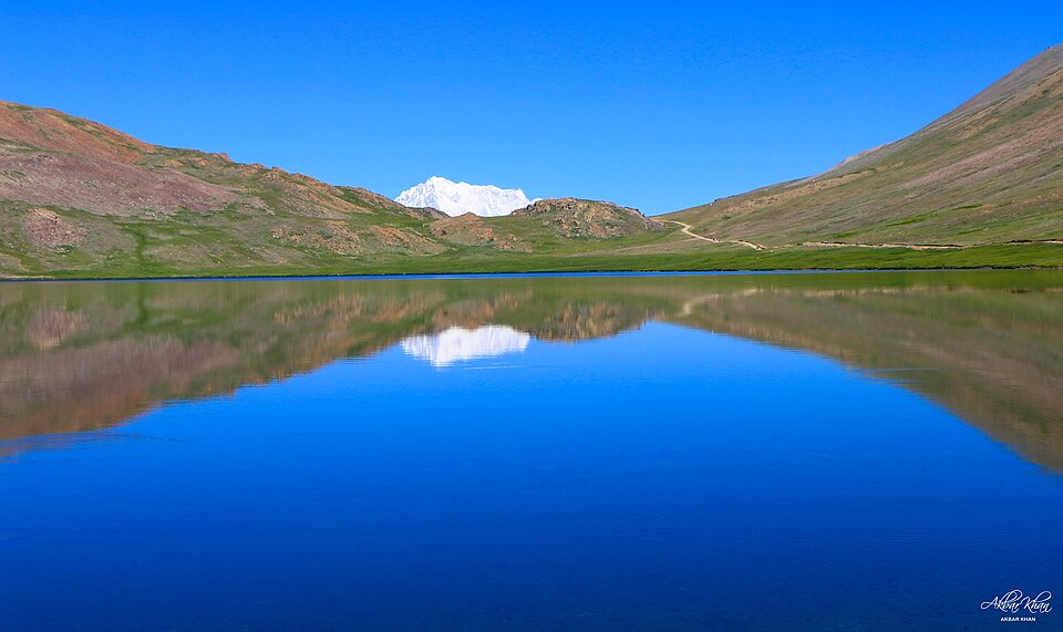 Mountain lake with majestic peak reflection - teletherapy vs in-person